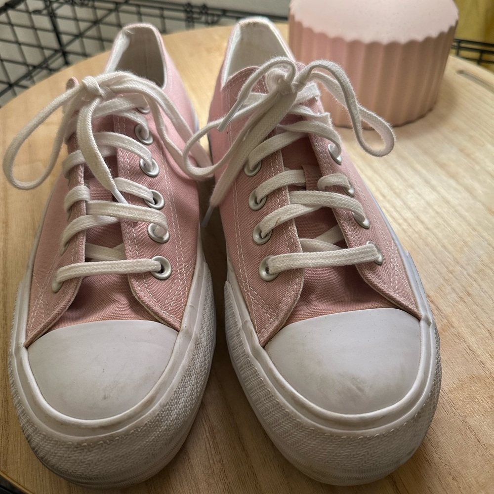 Pink and white canvas shoes
